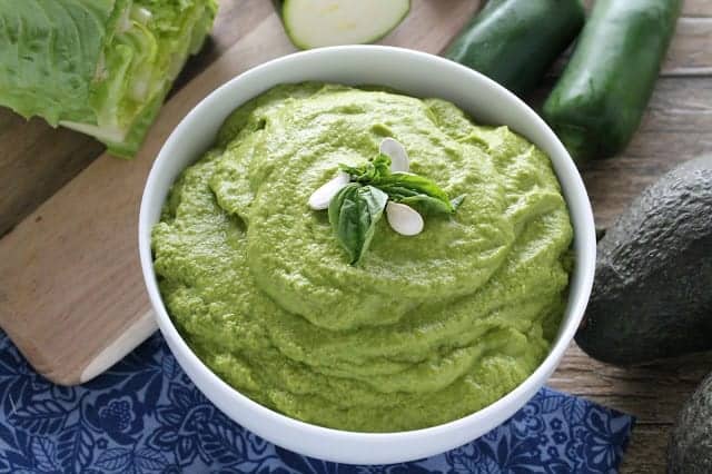 Mole Verde topped with basil in a white bowl.