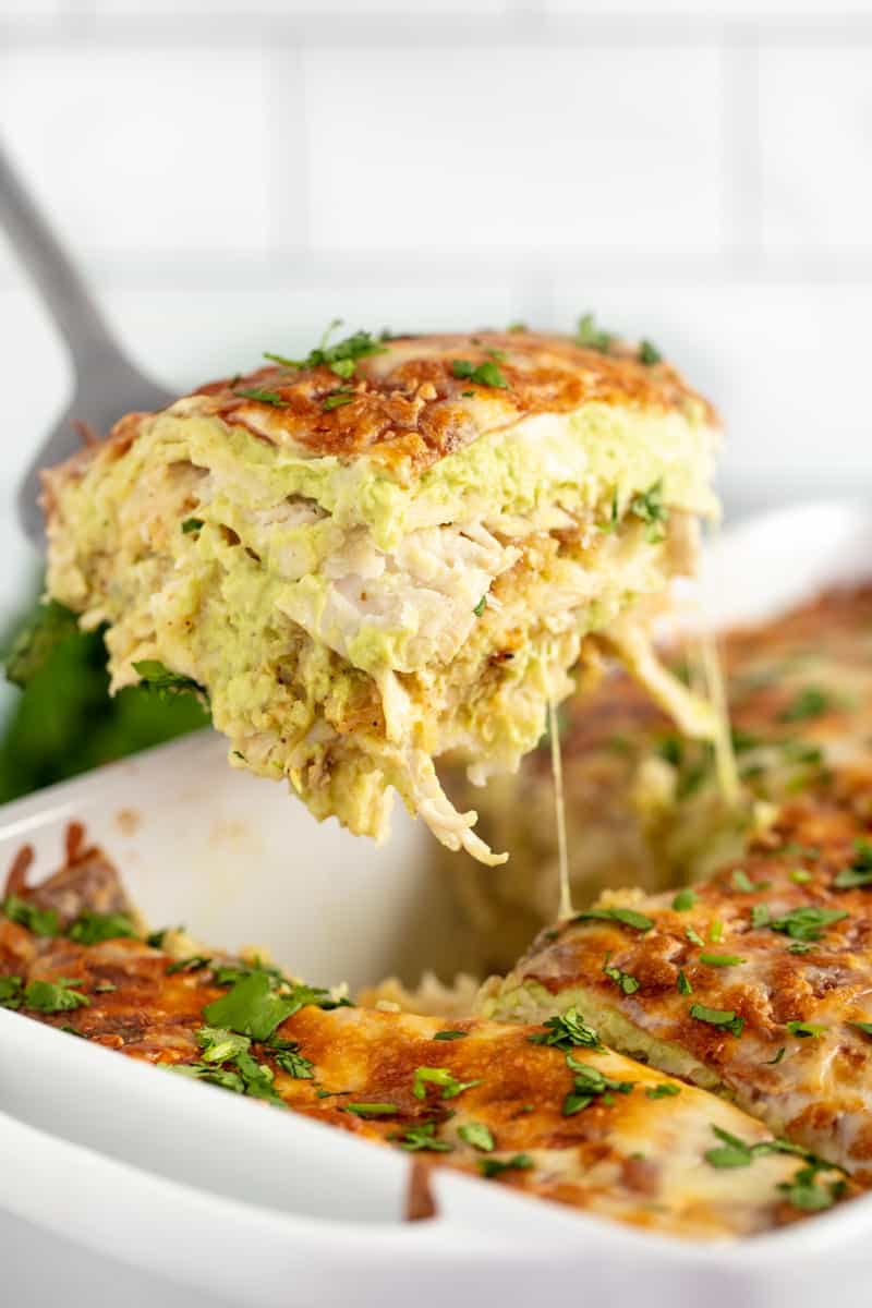 This Chicken Enchilada Casserole is made with an avocado cream sauce for an easy creamy ch Creamy Chicken Enchilada Casserole