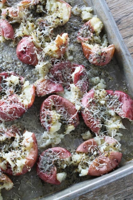 garlic bread smashed potatoes on baking sheet