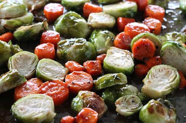 Roasted Brussel Sprouts and Carrots on a baking tray.