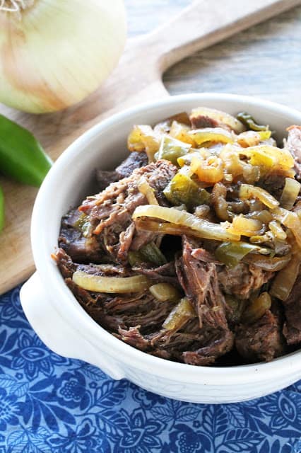 Slow cooker green Chile beef in a white bowl