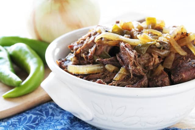 Green Chile beef in a white serving bowl