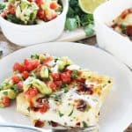 Spicy Bacon Lasagna with onion, jalapeno, and cilantro. Top it off with a fresh avocado salsa for a spic spin on classic lasagna. And, hello! Bacon!