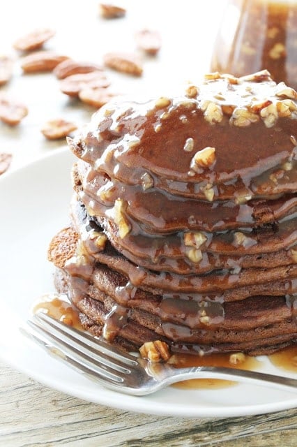  Gingerbread Pancakes are smothered with a quick and easy Butter Pecan Syrup in this holid Gingerbread Pancakes with Butter Pecan Syrup