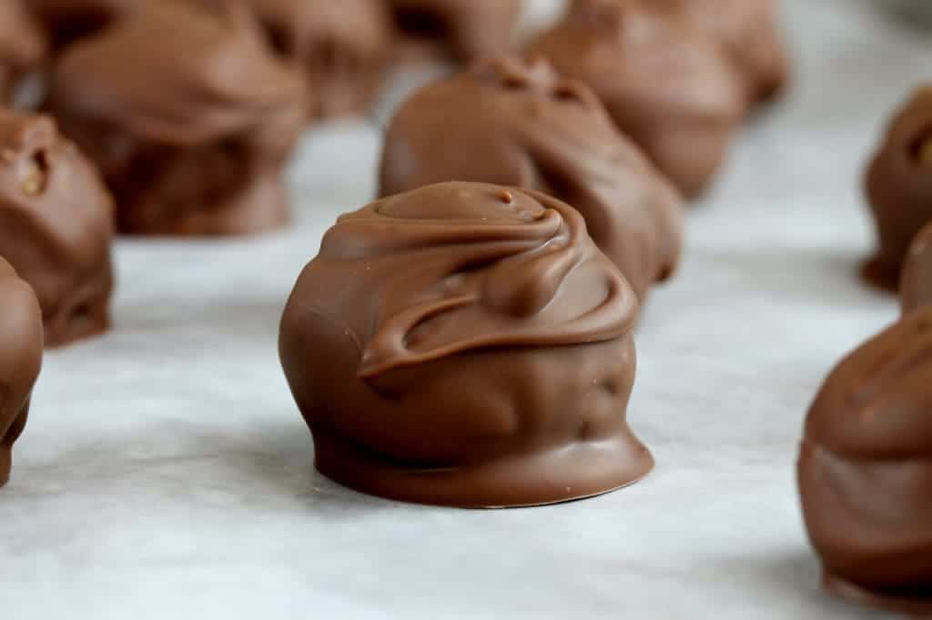 Gingersnap truffles dipped and swirled in melted milk chocolate