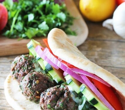 Lamb Meatball gyros on a wooden countertop