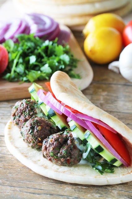 Lamb Meatball gyros on a wooden countertop