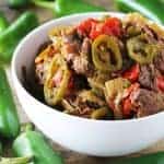 Tender and flavorful shredded beef with peppers and onions, all cooked low and slow in the crockpot.