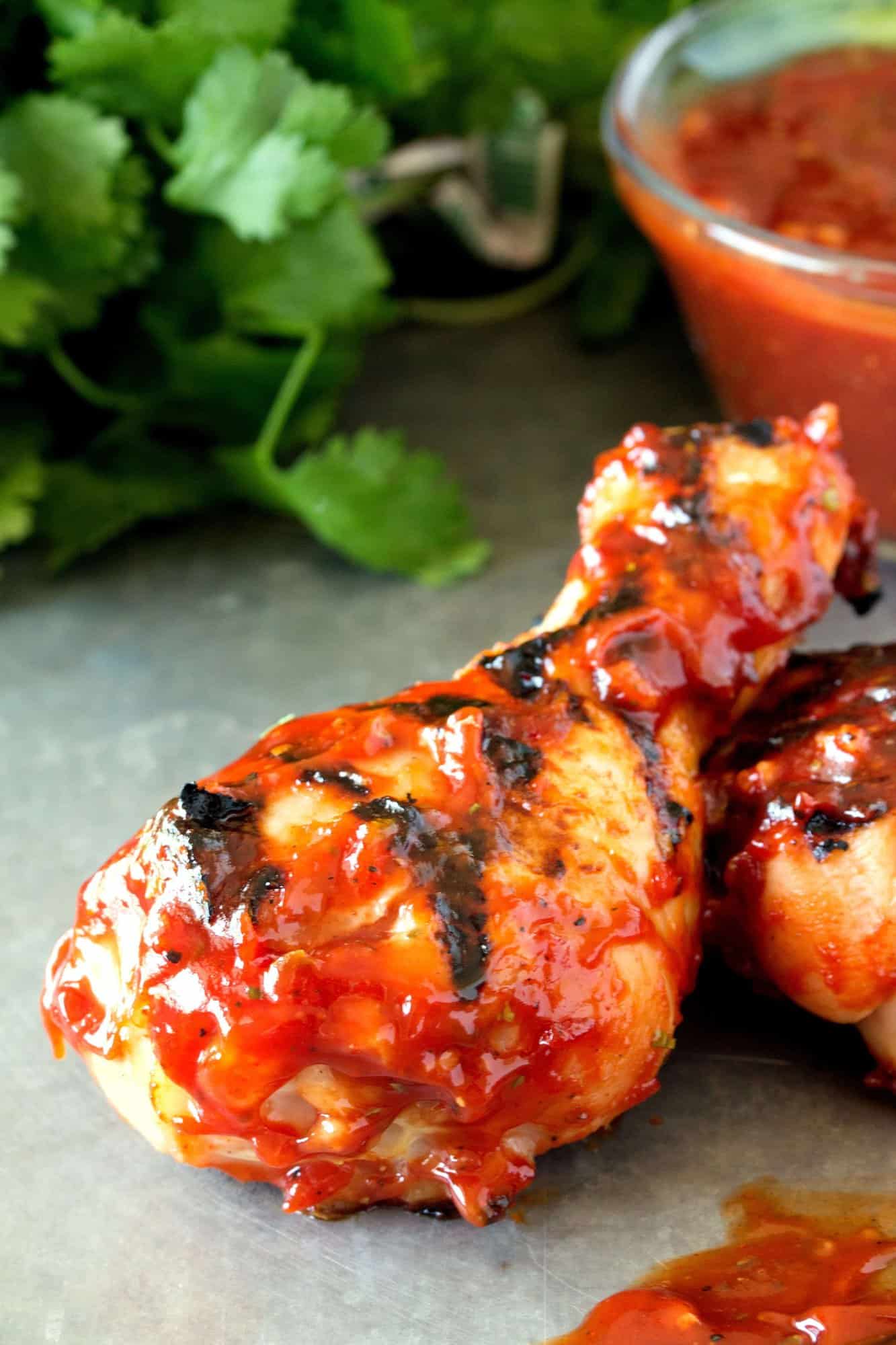  A homemade hickory smoked BBQ sauce is brushed over chicken drumsticks and grilled to perfection. These Hickory Smoked BBQ Chicken Drumsticks are a tasty backyard barbecue delight!