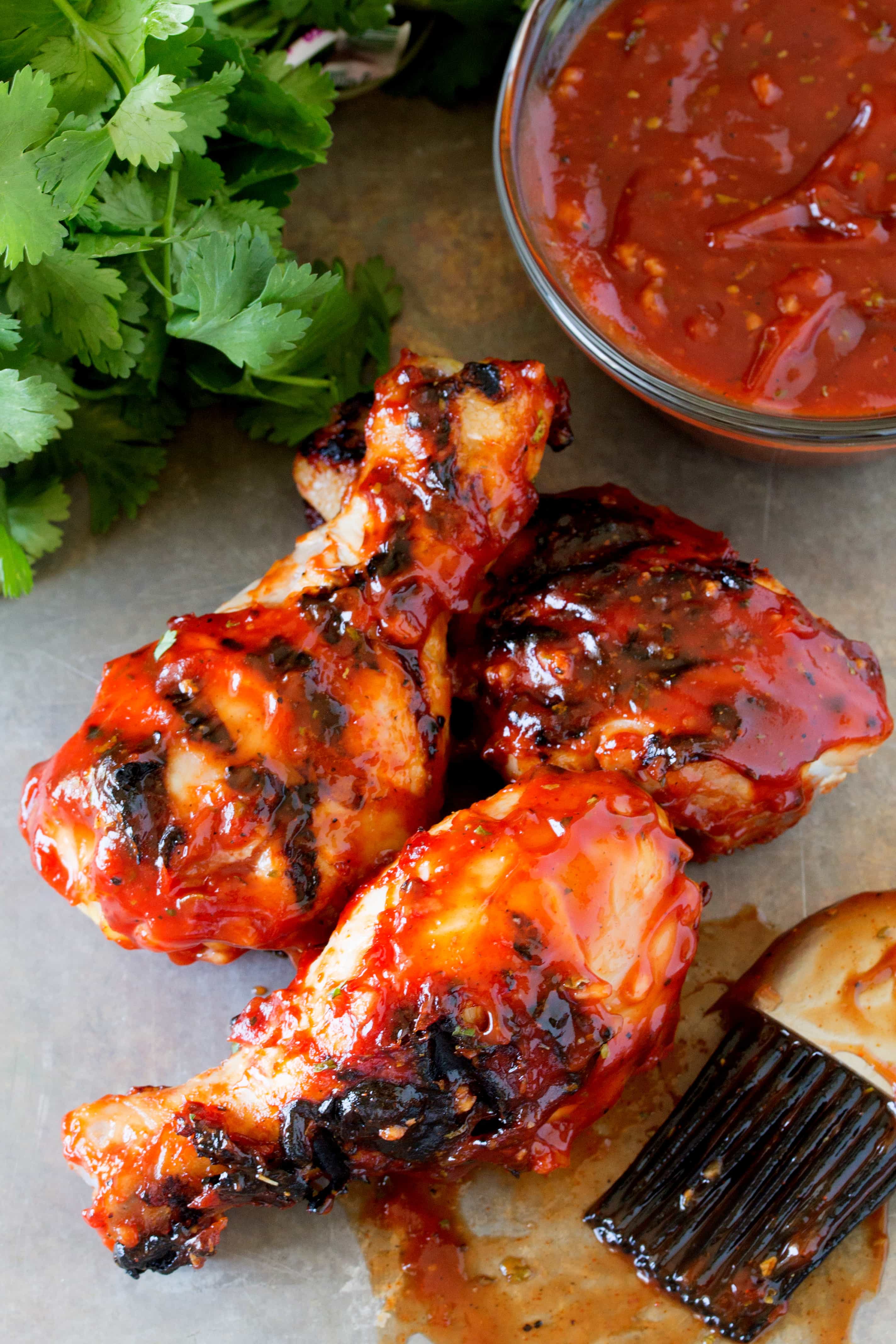 Smoked bbq sauce Chicken Drumsticks on a counter.