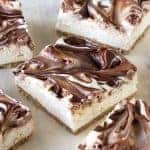 Light and fluffy cheesecake swirled with creamy Nutella sits on top of a graham cracker cr No Bake Nutella Swirl Cheesecake Bars