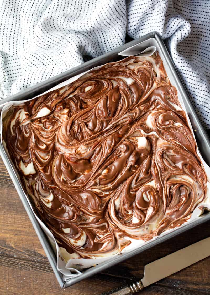 Light and fluffy cheesecake swirled with creamy Nutella sits on top of a graham cracker cr No Bake Nutella Swirl Cheesecake Bars