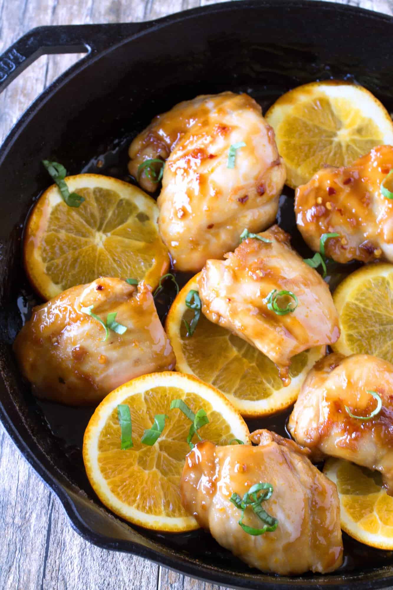 Orange Glazed Chicken Thighs in a skillet.