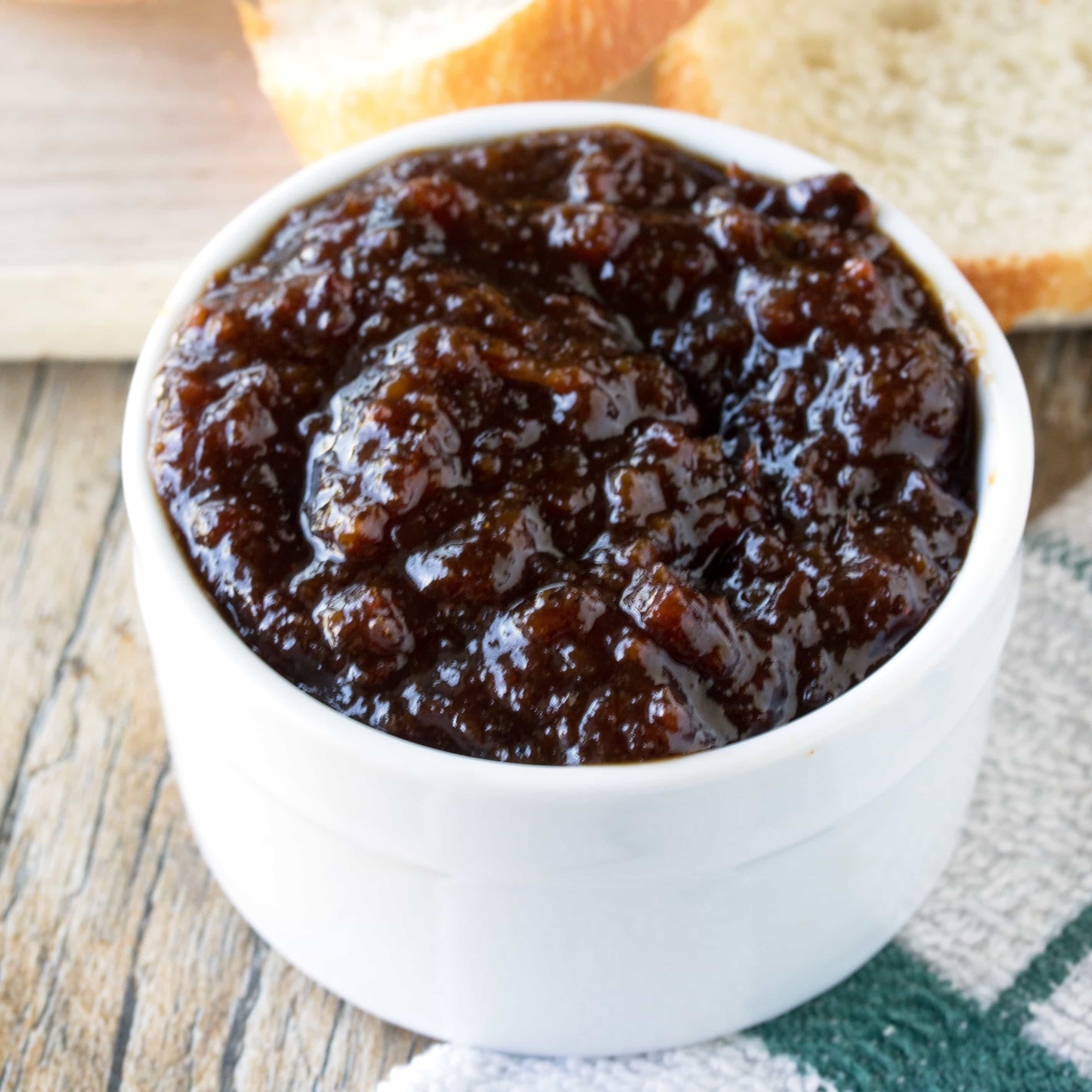 Bacon jam in a white bowl.