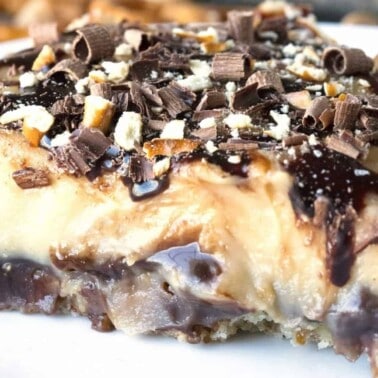 A salty pretzel crust layered with gooey hot fudge, a silky and creamy peanut butter custard for the filling and topped with curls of chocolate, chocolate fudge and crushed pretzels.