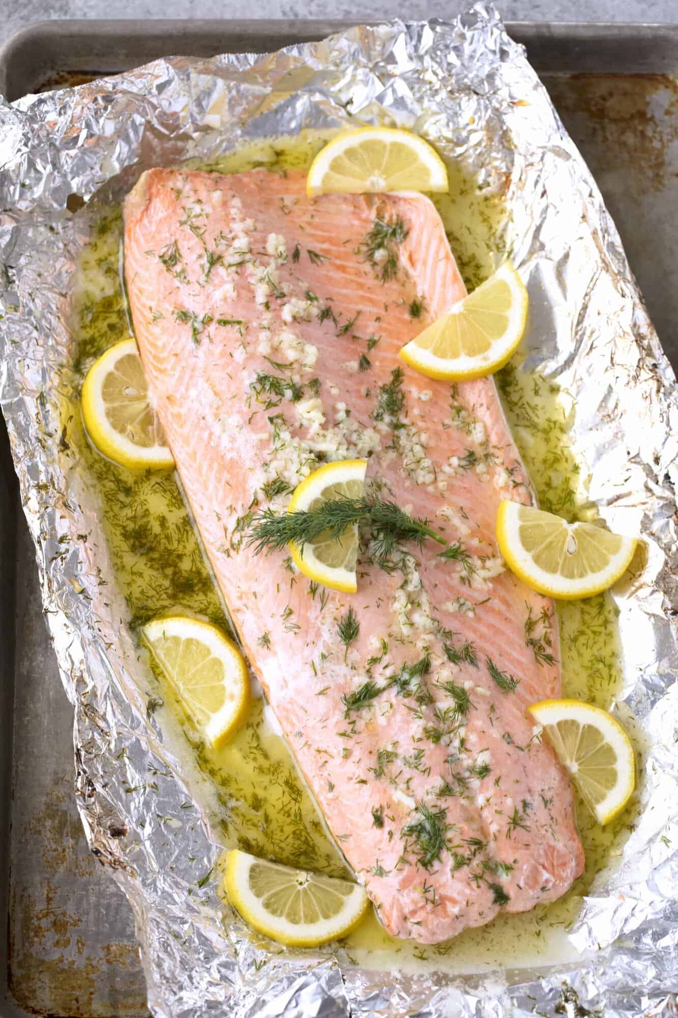 It doesn't get much easier than this Easy 5 Ingredient Baked Salmon with a garlic, lemon, and dill butter sauce. All it takes is 5 ingredients and 20 minutes of your time. So simple, so flavorful!