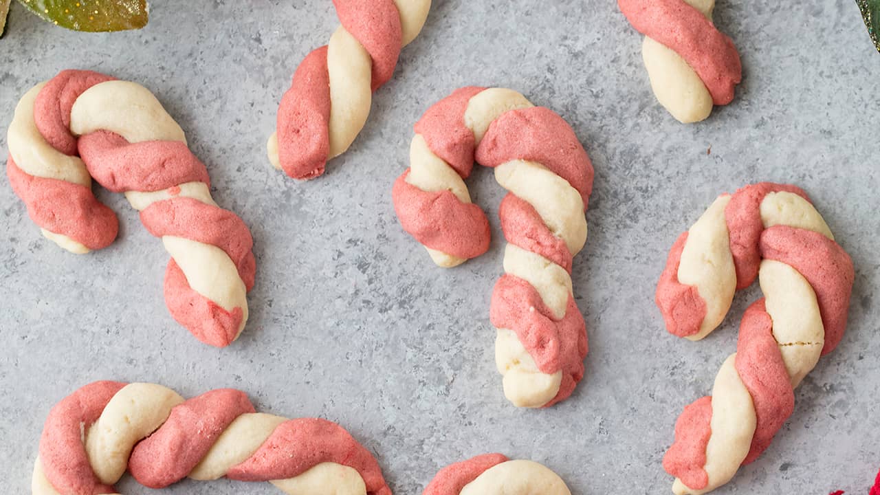 Bird's eye view of Cinnamon Candy Cane Cookies on a concrete countertop.