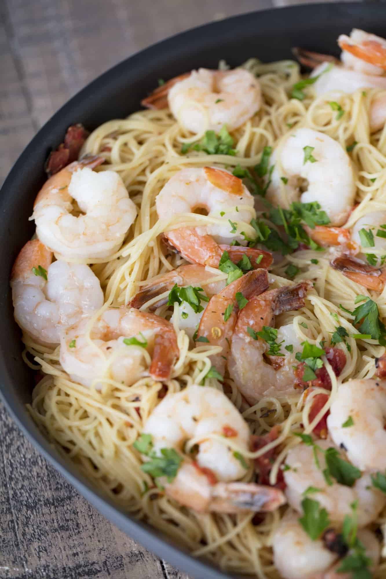 close up of Bird's eye view of Tomato Shrimp Angel Hair Pasta in a pan.