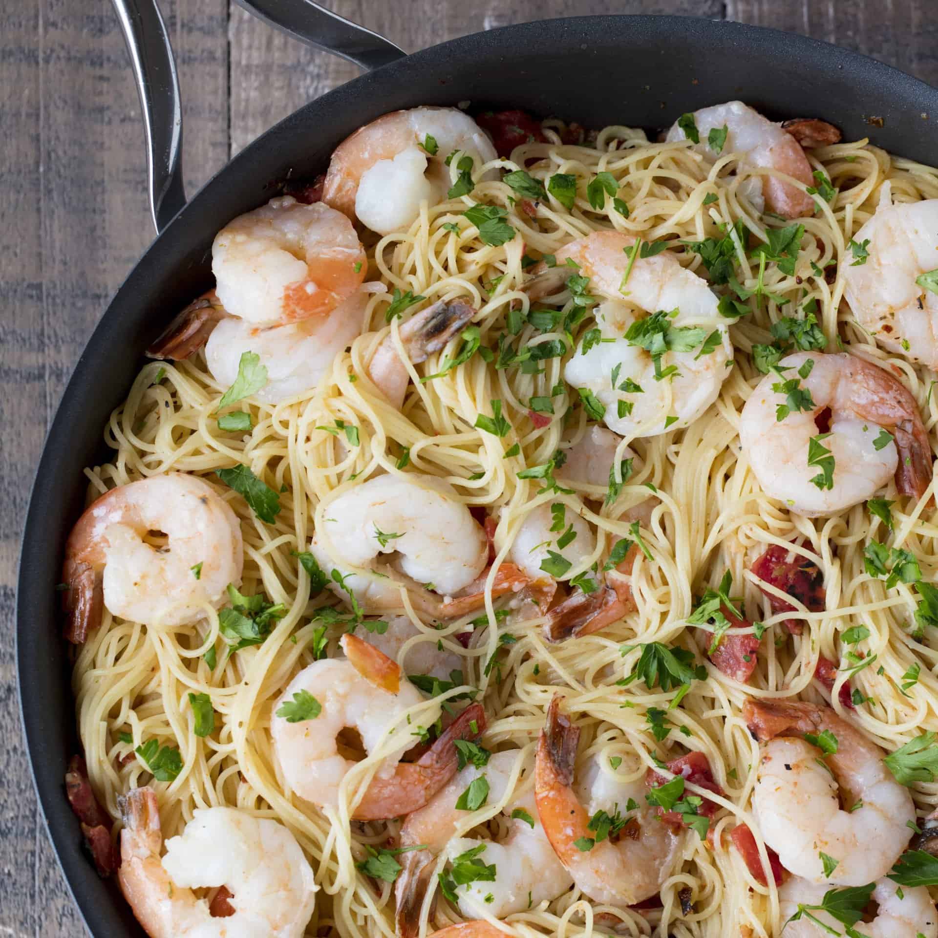 This Easy Creamy Tomato Shrimp Angel Hair Pasta is ready in just 15 minutes, but it tastes like it came from a restaurant. This will quickly become a family favorite!