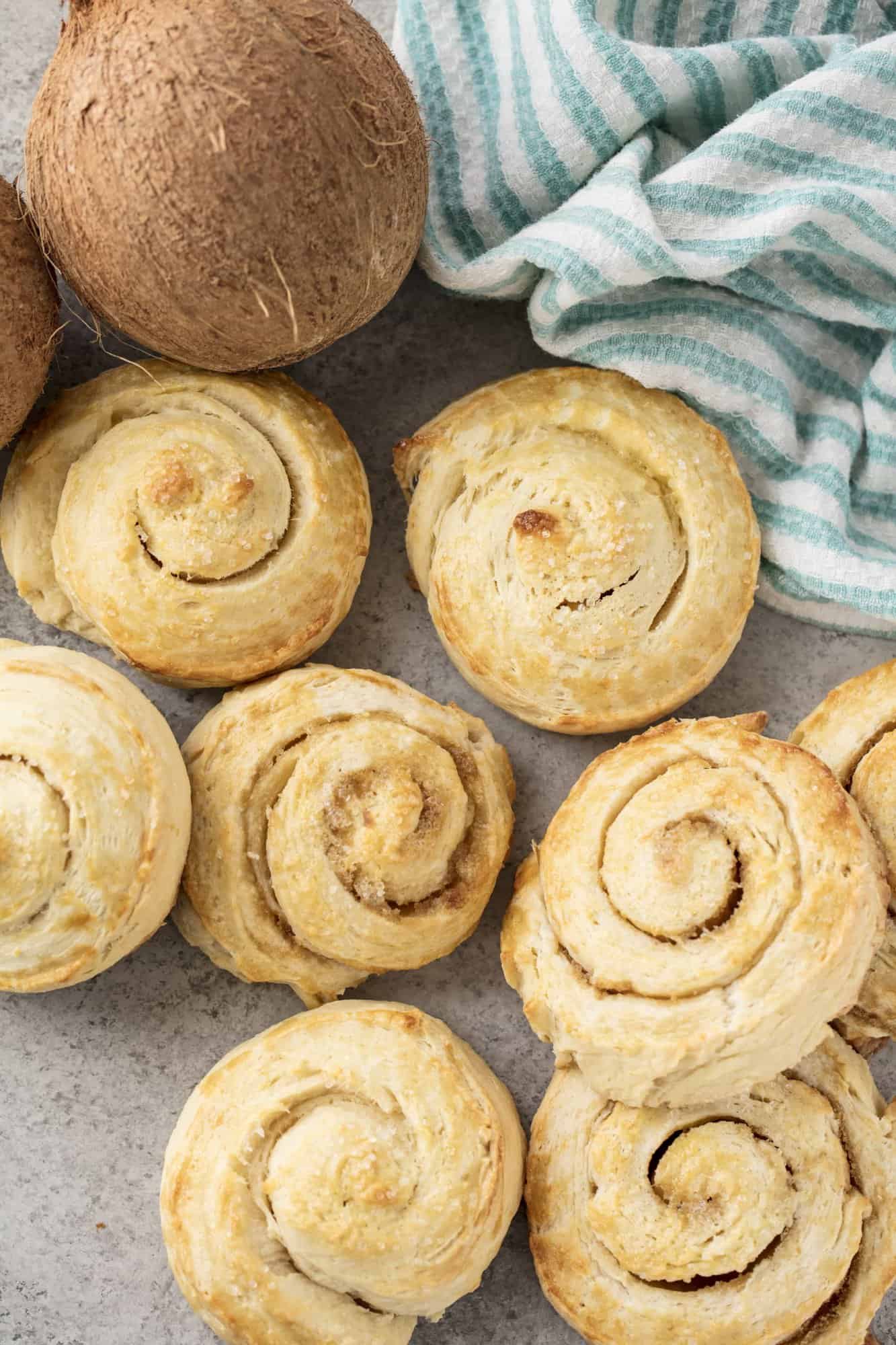 Bird's eye view of coconut rolls on a countertop.