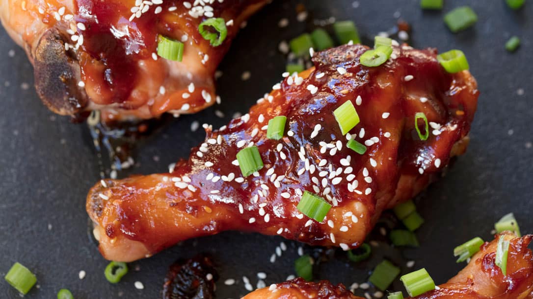 Korean Glazed Drumstick with sesame seeds and green onions as a garnish