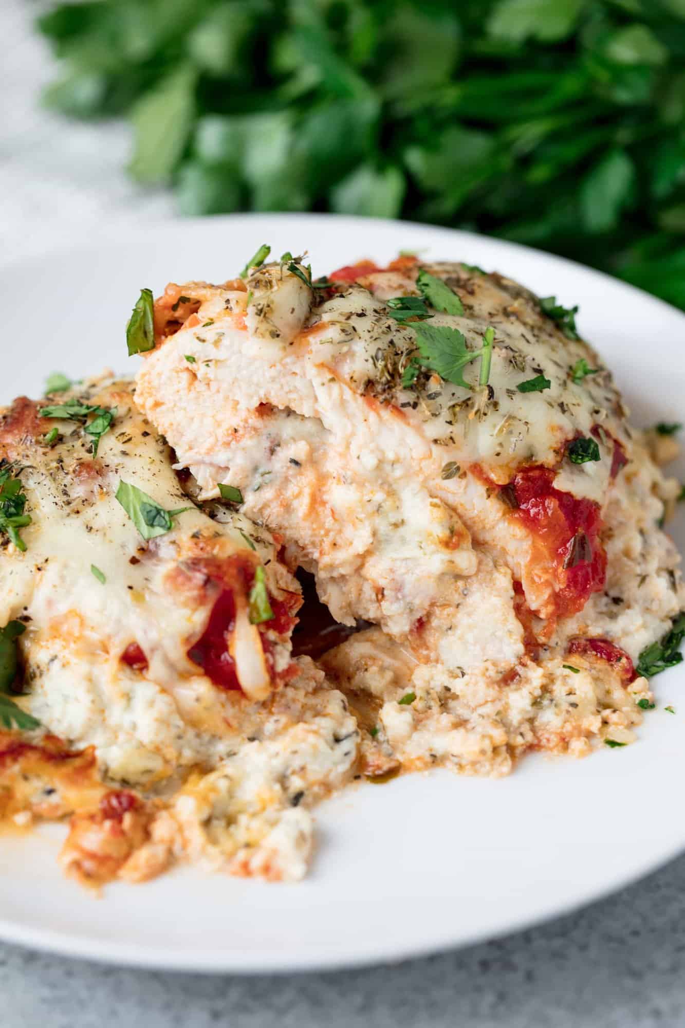 Lasagna Stuffed Chicken is all the flavors you love from lasagna stuffed inside a chicken breast and it's smothered in cheesy, saucy goodness. What's not to love?