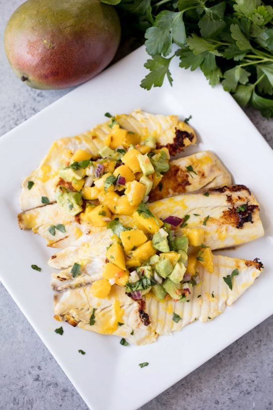 Mango and avocado salsa on a tilapia filet