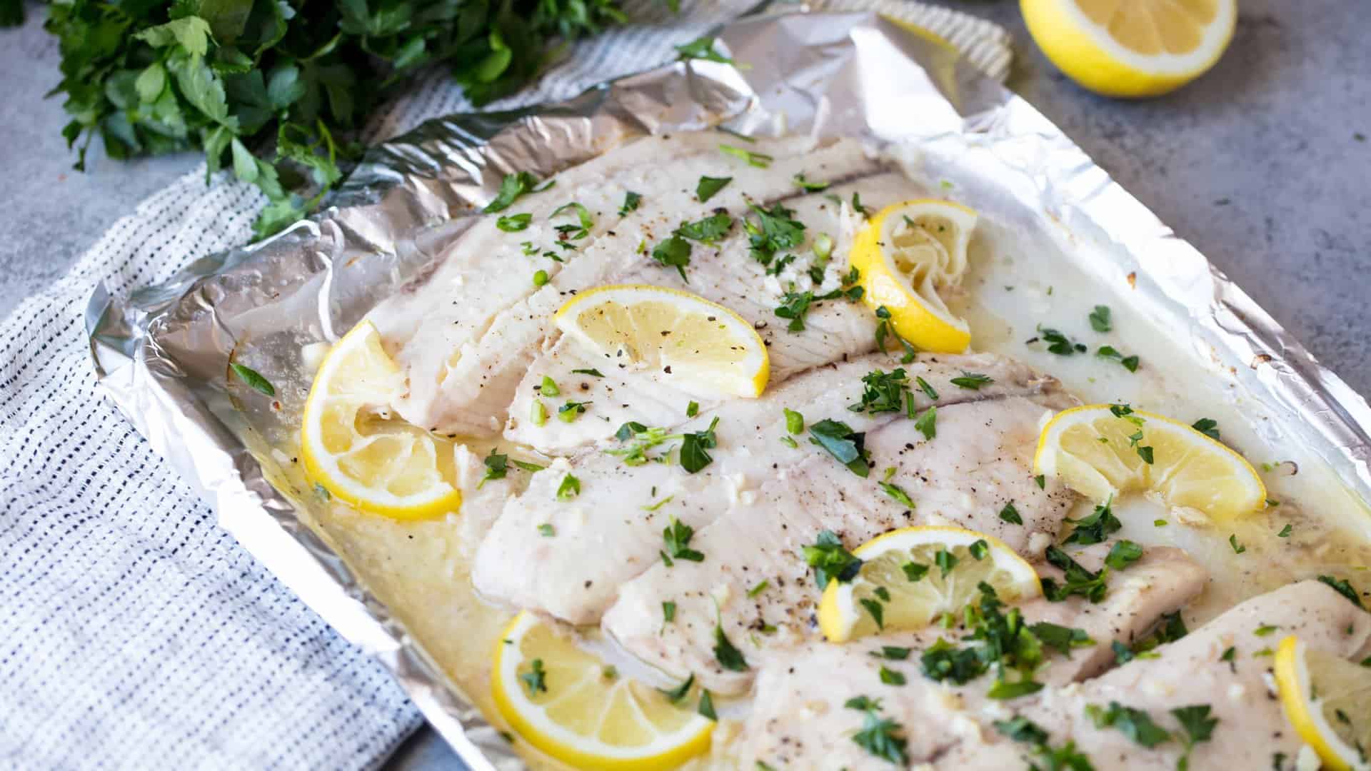 Baked Lemon Garlic Tilapia is the easiest and tastiest way to get healthy fish onto the dinner plate. Cooking fish at home has never been easier!