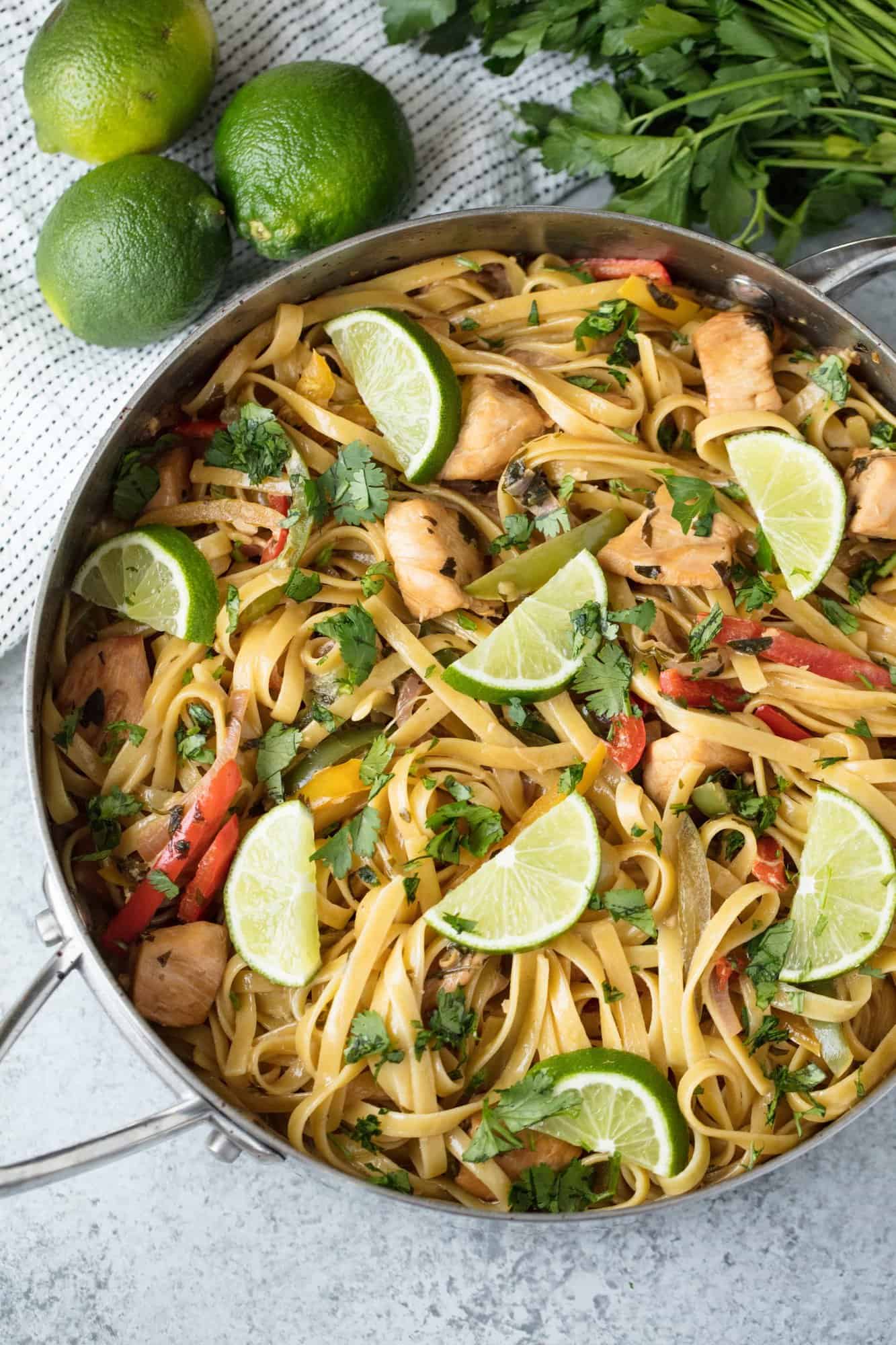 Tequila Lime Chicken Pasta is fun, vibrant, and full of flavor. This easy weeknight dinner is a complete meal with meat, veggies, and pasta all in one amazing dish. And the tequila burns off so it's family friendly too!