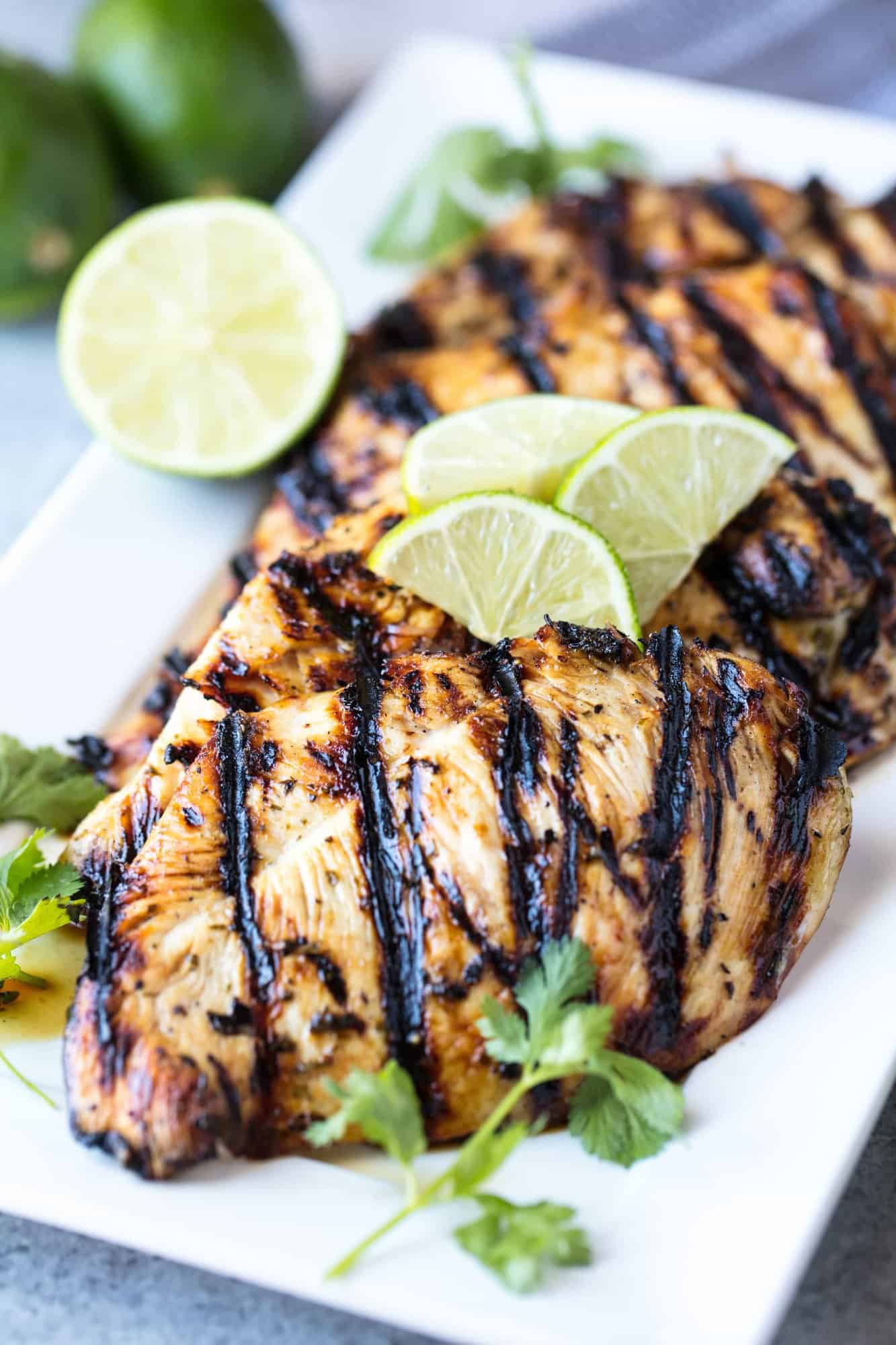 Margarita Grilled Chicken is salty lime goodness that's perfect for a party! This easy grill recipe is perfect for summer parties, backyard barbecues, and cookouts and can feed a family for a weeknight meal, or easily feed a crowd.