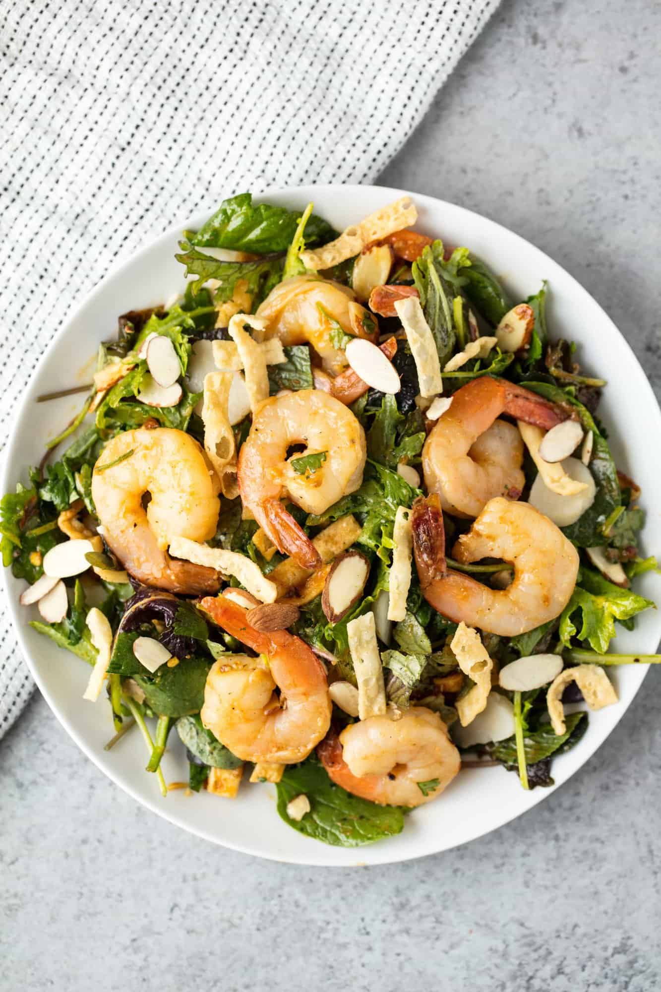 This easy Thai Shrimp Salad comes together in less than 15 minutes making it a great option for a weeknight meal. It's light, refreshing, and oh so tasty!