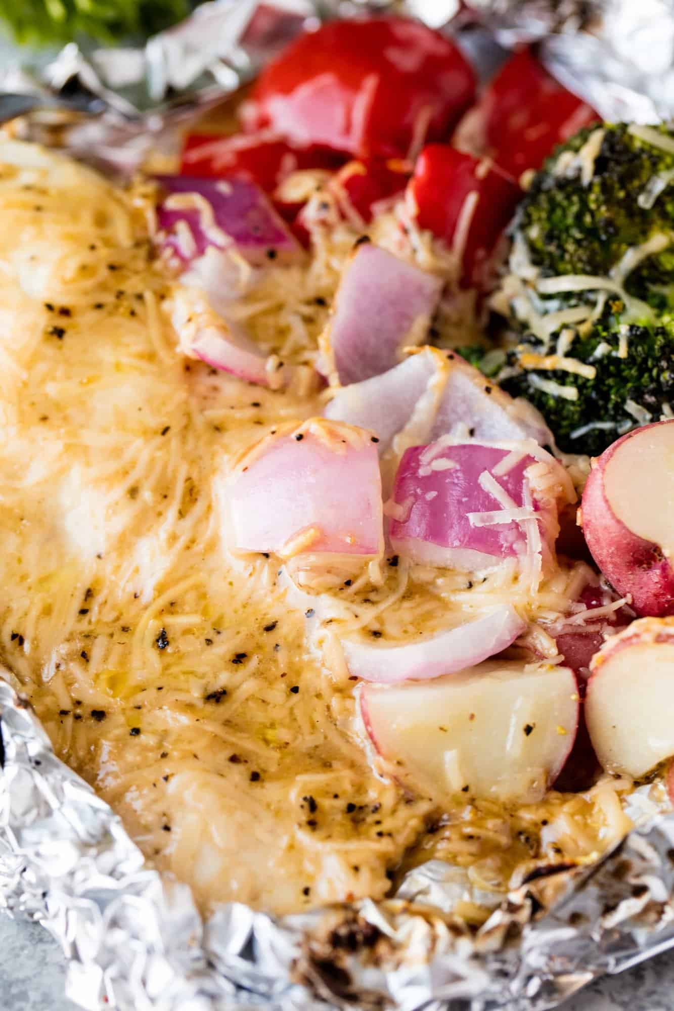 Cheesy Ranch Chicken Foil Packets are super easy to put together for a make ahead meal that can be cooked on the grill, in the oven, and is great for camping, picnics, and barbecues!