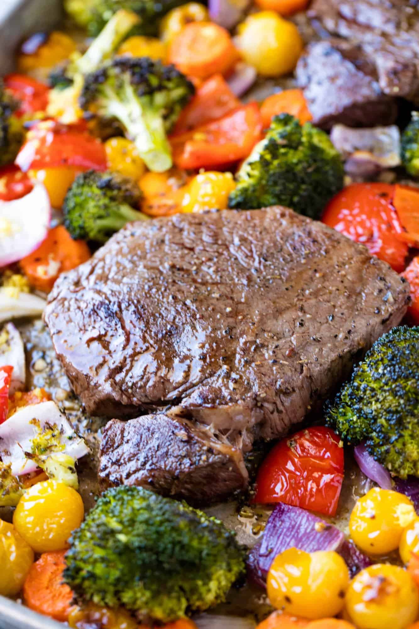 Italian Sheet Pan Steak and Veggies is a one pan meal with a colorful medley of vegetables and an Italian inspired butter sauce that keeps everything moist and flavorful.