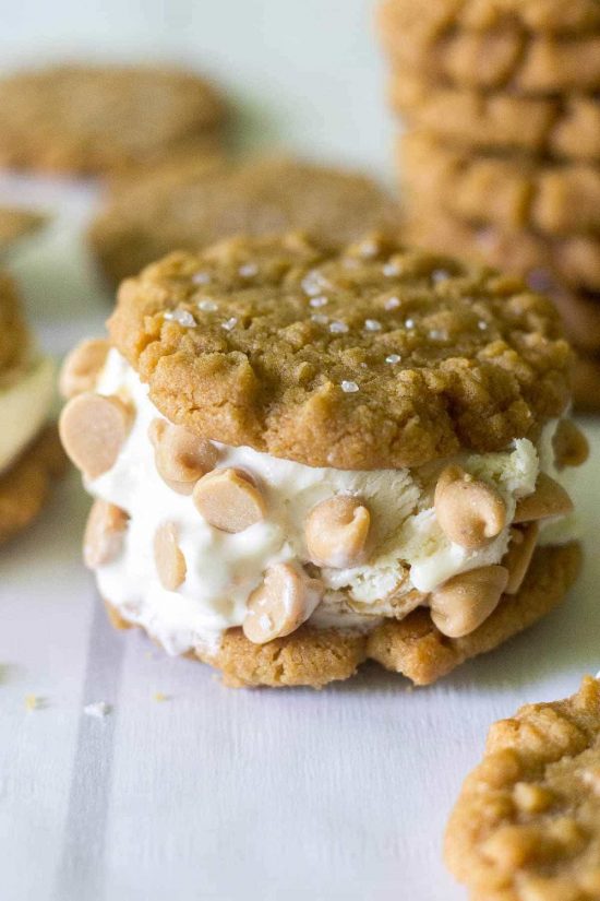 A Flourless Peanut Butter Cookie Flourless Peanut Butter Cookie Ice Cream Sandwich with peanut butter chips folded into the ice cream