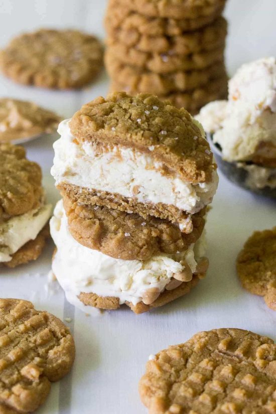 Calling all peanut butter lovers! These easy peanut butter cookie ice cream sandwiches are made with flourless peanut butter cookies and homemade peanut butter swirl ice cream. This is the ultimate summer dessert!