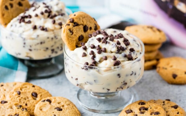 Chocolate Chip Cookie Dough Pudding in a glass bowl with a cookie in it.