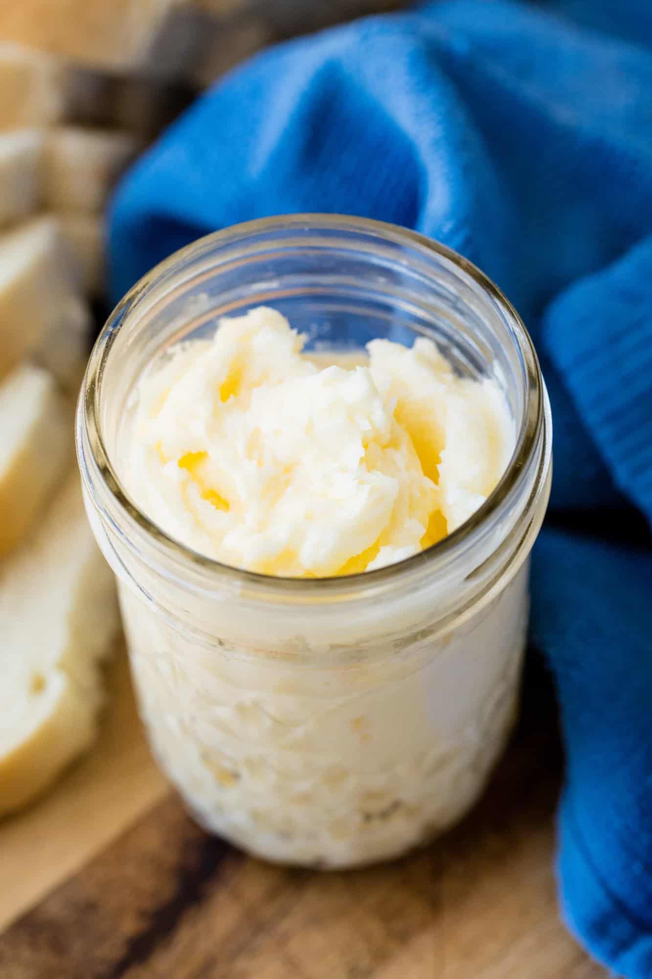 Learn how to make Homemade Butter in a Mason Jar in this fun pioneer activity for kids and adults alike! It's easy to churn your own butter and make your own buttermilk!