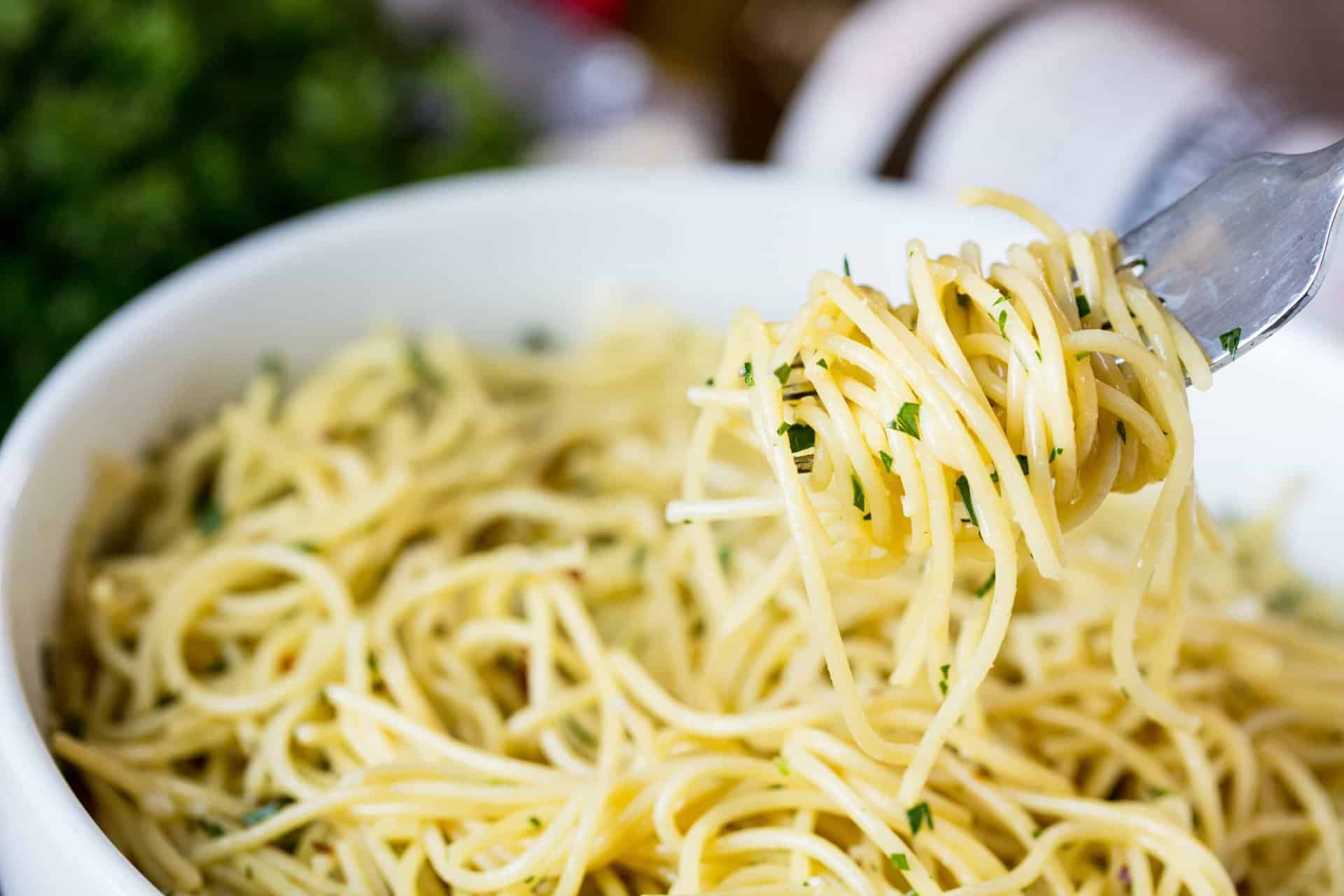 This Super Easy Olive Oil Pasta is a simple side dish that is quick to make and easily customizable to become a full meal. Just add meat and veggies!