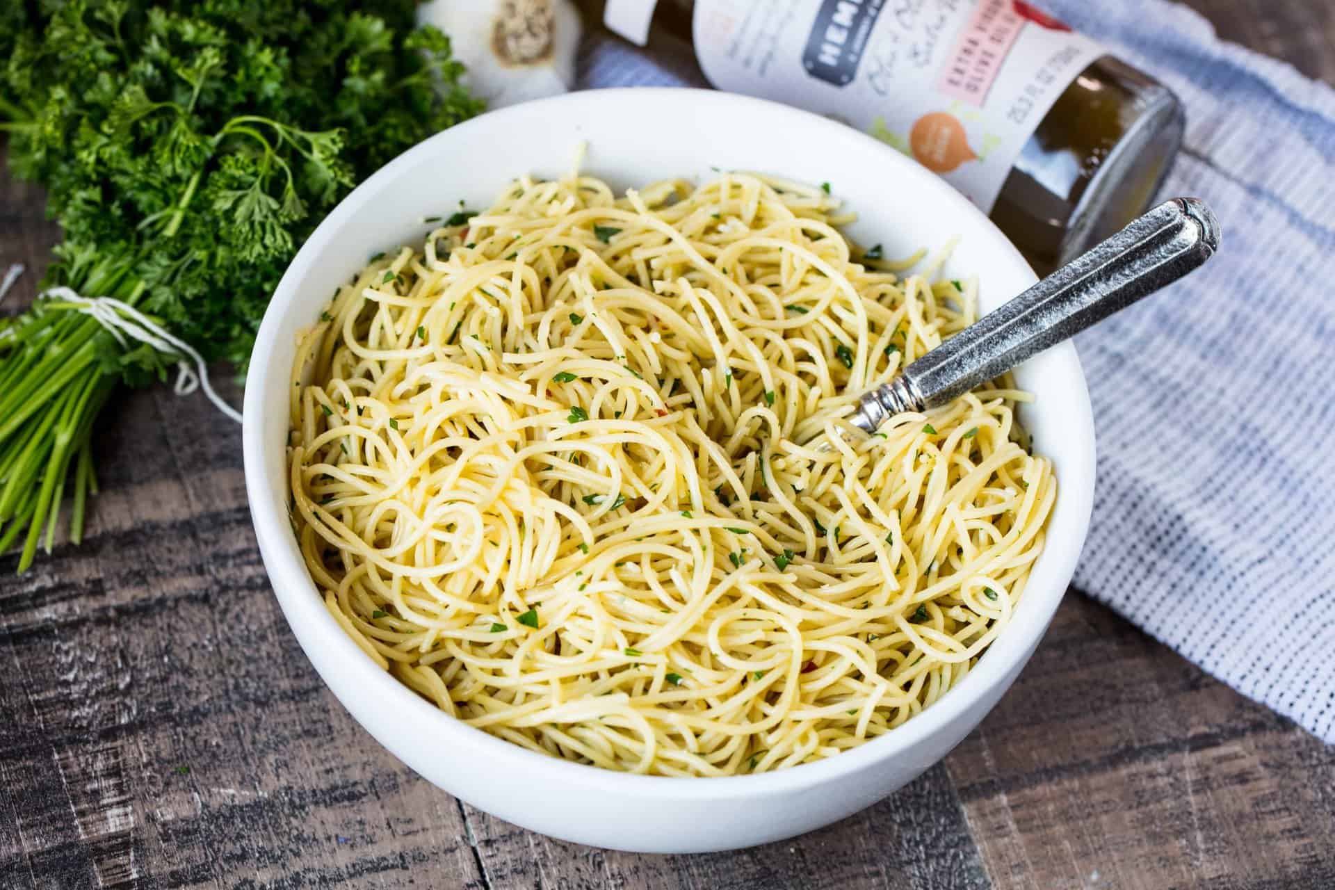 This Super Easy Olive Oil Pasta is a simple side dish that is quick to make and easily customizable to become a full meal. Just add meat and veggies!