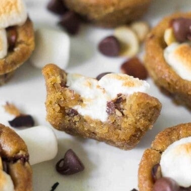 Easy Rocky Road Cookie Cups filled with chocolate chips, slivered almonds, and marshmallows