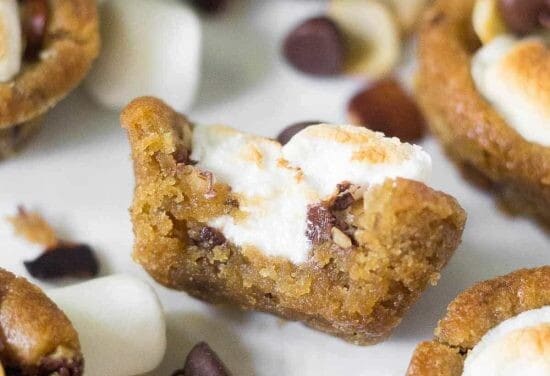 Easy Rocky Road Cookie Cups filled with chocolate chips, slivered almonds, and marshmallows