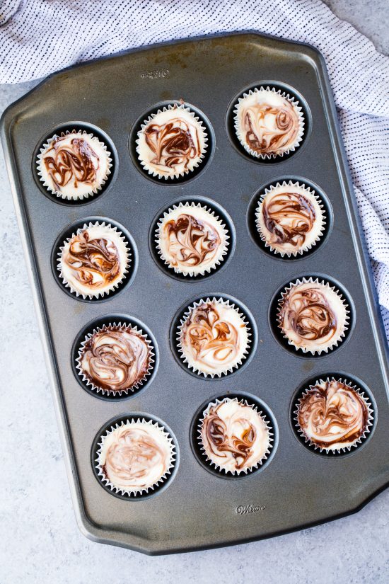 Fudge Swirled Oreo Bottom Cheesecake Cupcakes