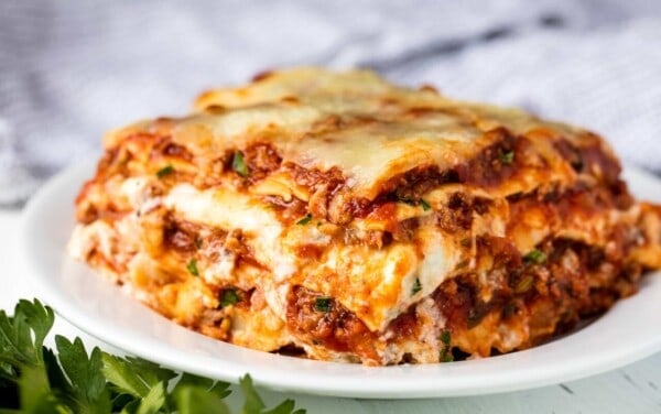 The Most Amazing Lasagna Recipe is the absolute perfect recipe for homemade Italian-style lasagna. The balance between layers of cheese, noodles, and homemade bolognese sauce is perfection!