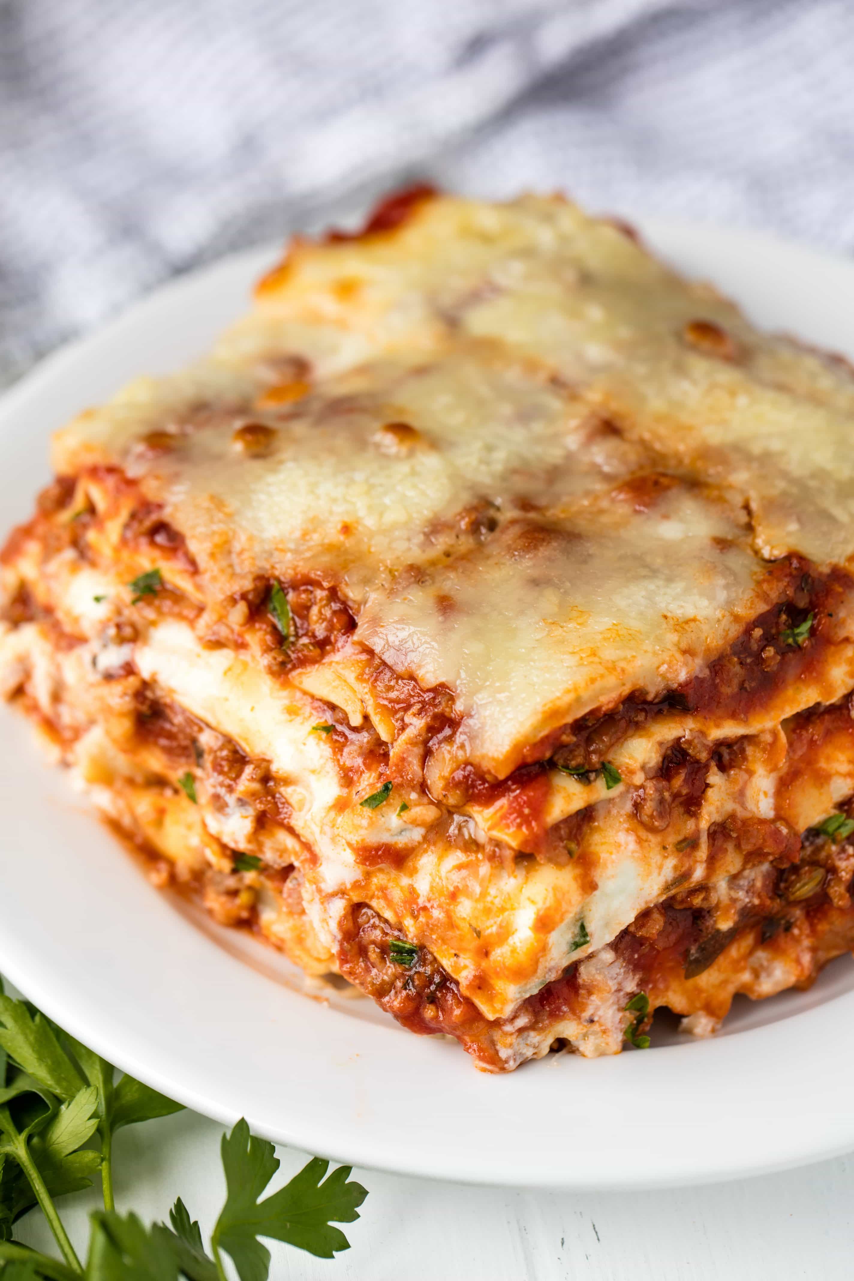 The Most Amazing Lasagna Recipe is the absolute perfect recipe for homemade Italian-style lasagna. The balance between layers of cheese, noodles, and homemade bolognese sauce is perfection!