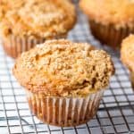 Sour Cream Coffee Cake Muffins on a wire cooling rack.