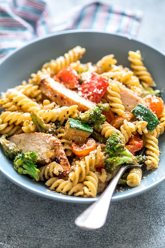 Easy Chicken Pasta Primavera is a delicious weeknight dinner recipe that's loaded with veggies and super simple to make! 