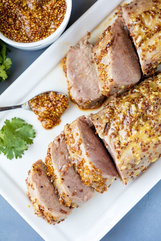 Perfectly tender Honey Dijon Garlic Roasted Pork Tenderloin only requires a few ingredients, and a few minutes of your time to get roasting in the oven. It's a flavorful, juicy pork tenderloin that your family will love!