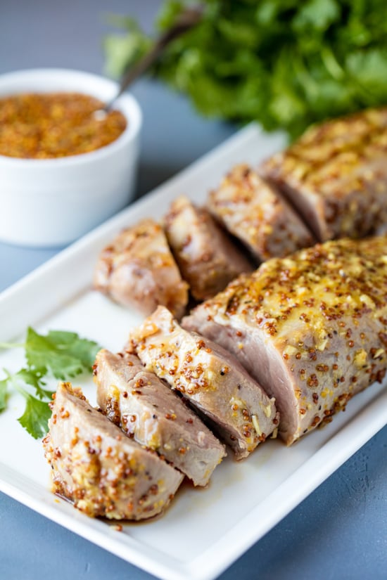 Perfectly tender Honey Dijon Garlic Roasted Pork Tenderloin only requires a few ingredients, and a few minutes of your time to get roasting in the oven. It's a flavorful, juicy pork tenderloin that your family will love!