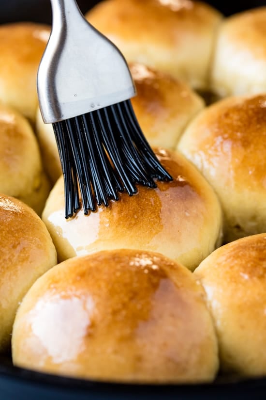 Rapid Rise Skillet Rolls are brushed with butter with a basting brush