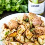 Roasted Parmesan Pesto Potatoes on a white plate.